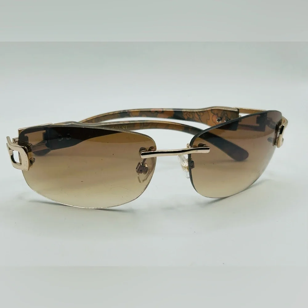 Vintage 90s Y2K Foster Grant Rimless gold link accent Sunglasses